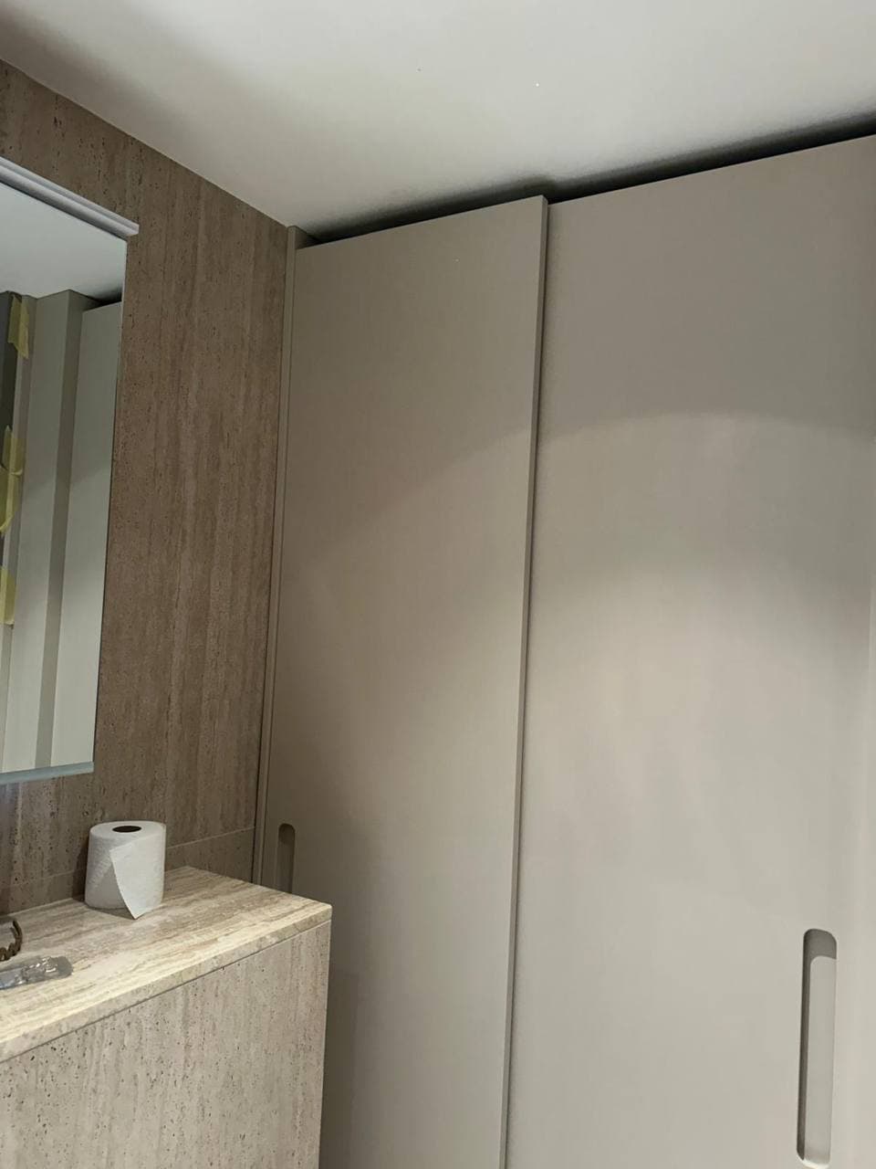 Bespoke waterproof bathroom storage cupboard installed within the Belgravia apartment bathroom