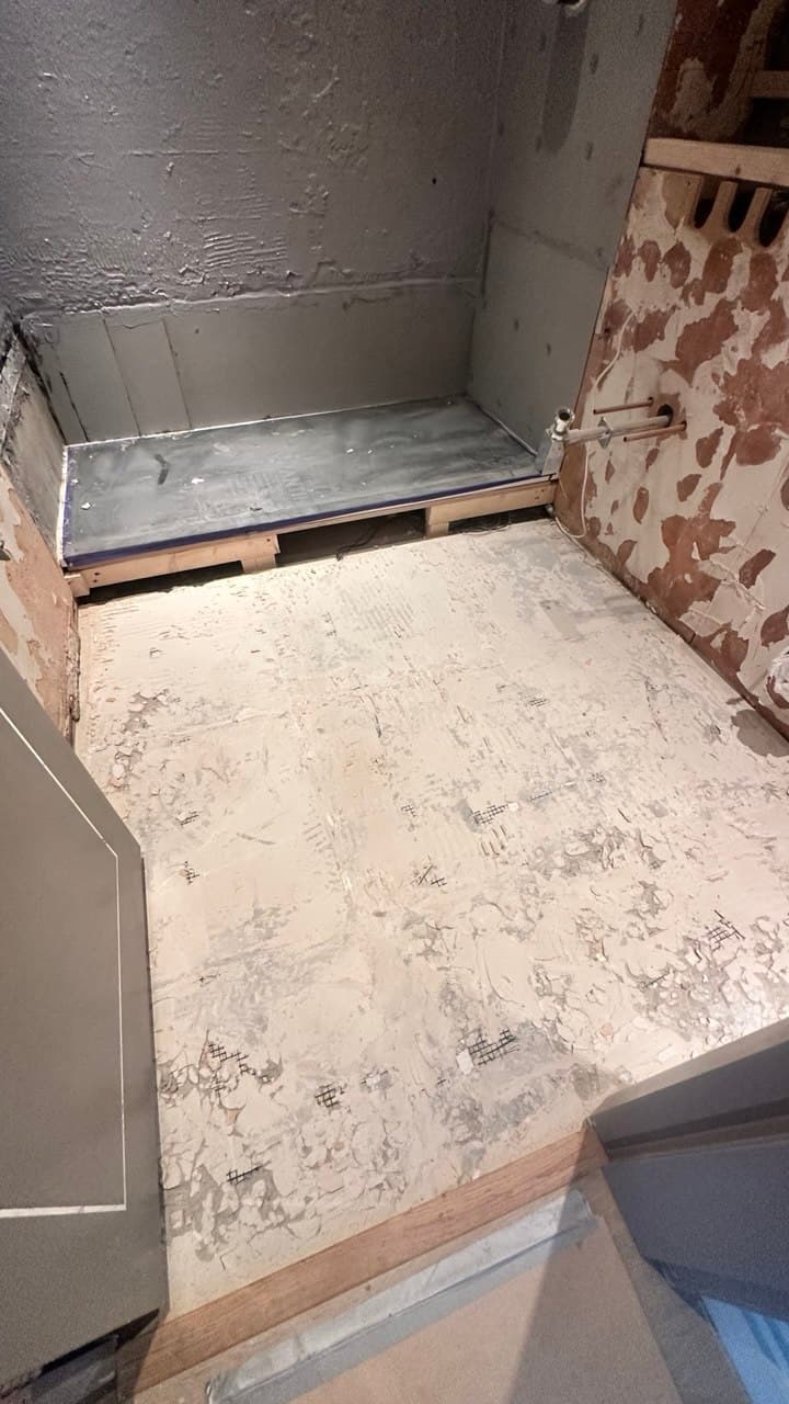 En-suite bathroom stripped out before marble installation