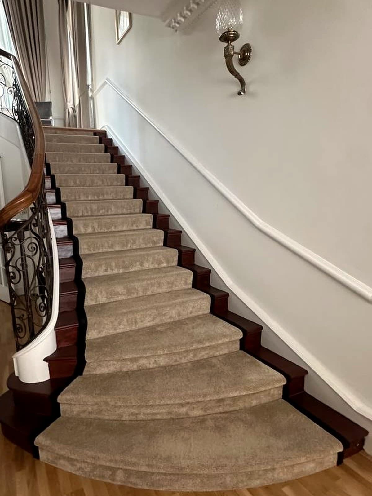 Existing curved staircase at the Campden Hill residence before renovation