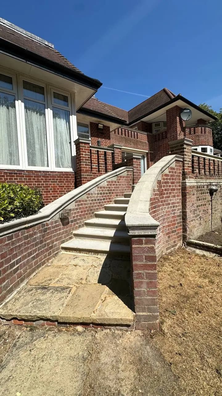 Brick terrace steps and rear elevation at the Campden Hill renovation project in Kensington W8