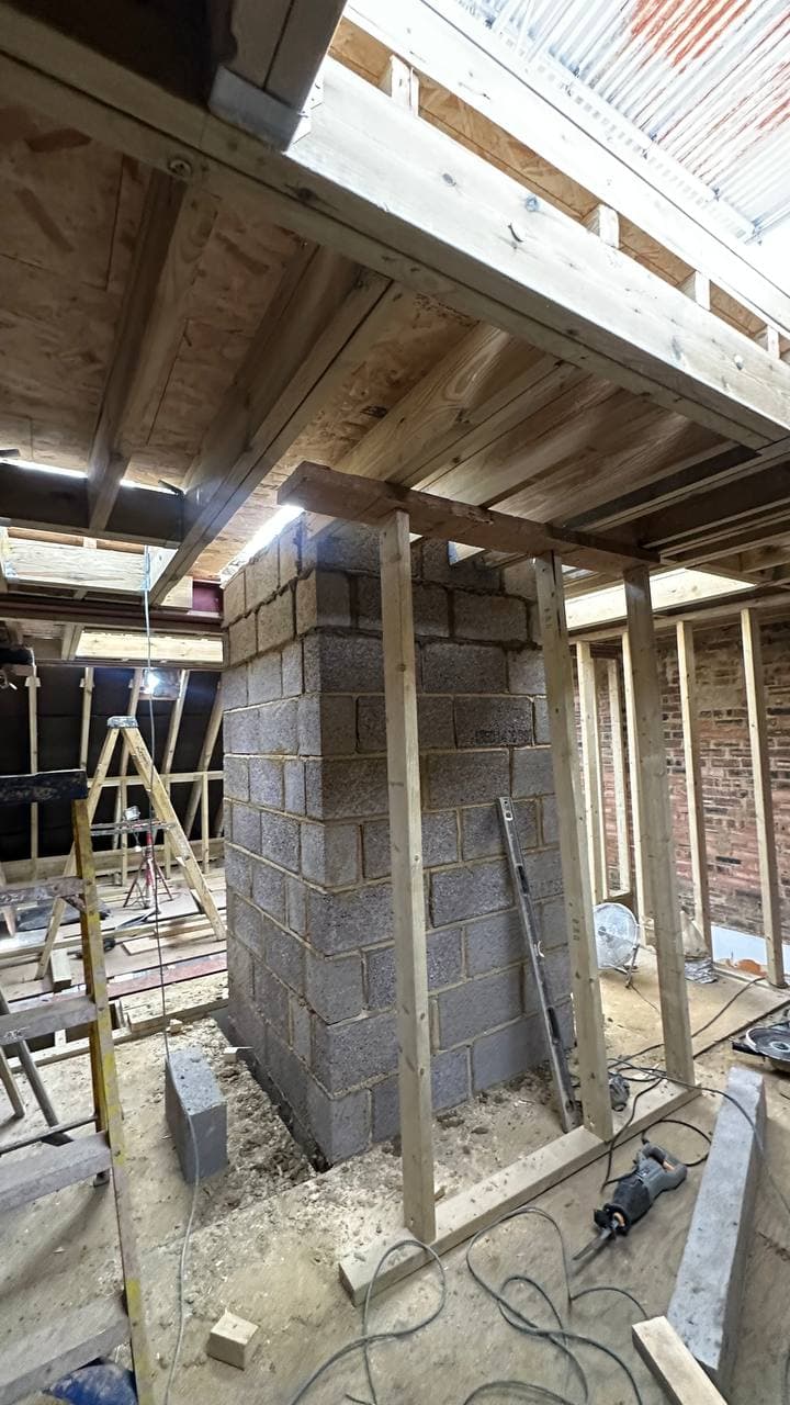 Passenger lift shaft construction progressing through the new floor structure