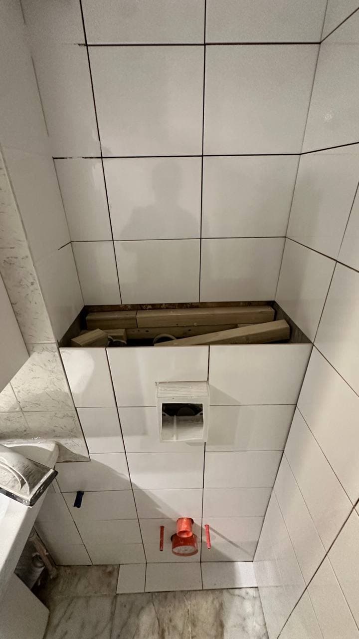 WC alcove fully tiled and prepared for final fit-off